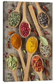 Lærredsbillede  Colorful spices in wooden spoons - Elena Schweitzer